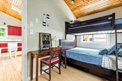 Beach vibes and vintage charm in this historic Grand Beach home on Grand Beach Municipal Golf Course in Michigan - for sale on GolfHomes.com, golf home, golf lot