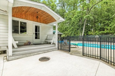 Beach vibes and vintage charm in this historic Grand Beach home on Grand Beach Municipal Golf Course in Michigan - for sale on GolfHomes.com, golf home, golf lot