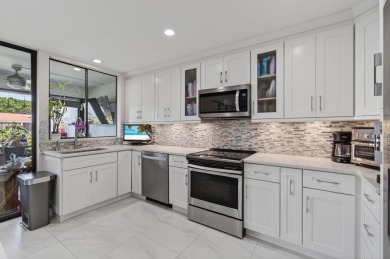 BEAUTIFULLY RENOVATED HOME WITH BREATHTAKING LAKE VIEWS on Boca West Golf and Country Club in Florida - for sale on GolfHomes.com, golf home, golf lot
