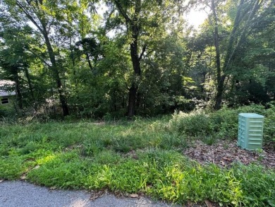 Build your dream home or weekend getaway on this 0.26-acre lot on Bella Vista Country Club - Berksdale in Arkansas - for sale on GolfHomes.com, golf home, golf lot