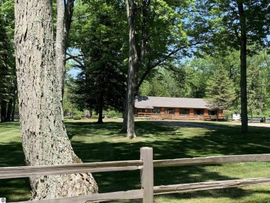 Embark on your Northern Michigan adventure with this spacious on Shanty Creek Golf Course in Michigan - for sale on GolfHomes.com, golf home, golf lot