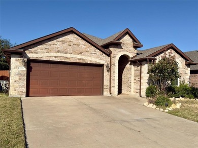 This very beautiful and well maintained 4-bedroom, 2-bath home on Eagle Mountain Country Club  in Texas - for sale on GolfHomes.com, golf home, golf lot