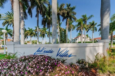 Find paradise in this one-of-a-kind lakefront villa in beautiful on Isla Del Sol Yacht and Country Club in Florida - for sale on GolfHomes.com, golf home, golf lot