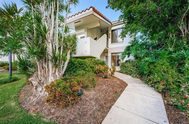 Find paradise in this one-of-a-kind lakefront villa in beautiful on Isla Del Sol Yacht and Country Club in Florida - for sale on GolfHomes.com, golf home, golf lot