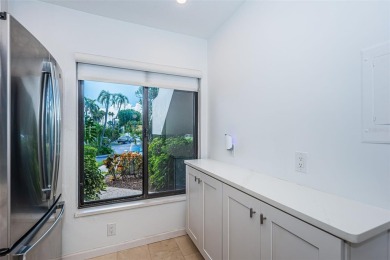 Find paradise in this one-of-a-kind lakefront villa in beautiful on Isla Del Sol Yacht and Country Club in Florida - for sale on GolfHomes.com, golf home, golf lot