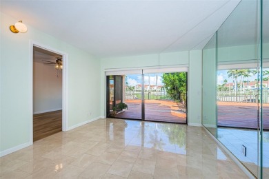 Find paradise in this one-of-a-kind lakefront villa in beautiful on Isla Del Sol Yacht and Country Club in Florida - for sale on GolfHomes.com, golf home, golf lot