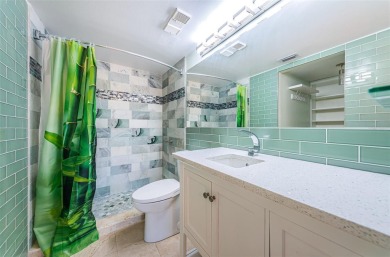 Find paradise in this one-of-a-kind lakefront villa in beautiful on Isla Del Sol Yacht and Country Club in Florida - for sale on GolfHomes.com, golf home, golf lot