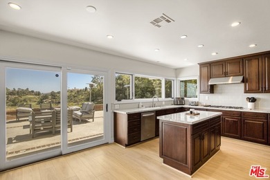 Golf Course & City Views! Perched in a prime Tarzana hillside on Braemar Country Club in California - for sale on GolfHomes.com, golf home, golf lot