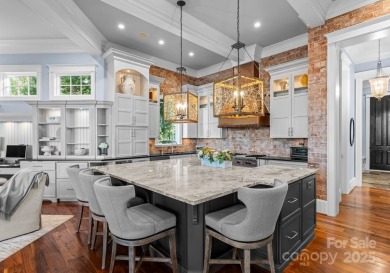 An exquisite lakefront property offering the perfect blend of on The Peninsula Club in North Carolina - for sale on GolfHomes.com, golf home, golf lot