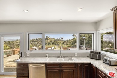 Golf Course & City Views! Perched in a prime Tarzana hillside on Braemar Country Club in California - for sale on GolfHomes.com, golf home, golf lot