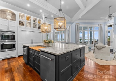 An exquisite lakefront property offering the perfect blend of on The Peninsula Club in North Carolina - for sale on GolfHomes.com, golf home, golf lot