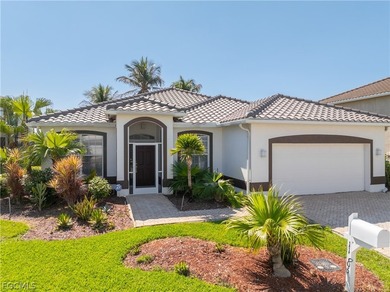SILVERLAKES SHOWSTOPPER WITH BRAND NEW TILE ROOF & WATERFRONT on Gateway Golf and Country Club in Florida - for sale on GolfHomes.com, golf home, golf lot