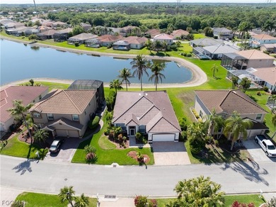 SILVERLAKES SHOWSTOPPER WITH BRAND NEW TILE ROOF & WATERFRONT on Gateway Golf and Country Club in Florida - for sale on GolfHomes.com, golf home, golf lot
