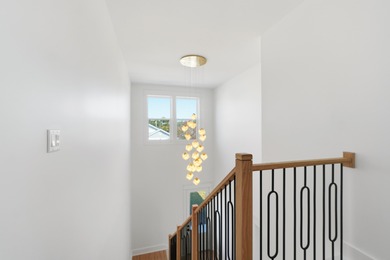 Brand-new 2025 coastal luxury home just steps from the Gulf! on Sharks Tooth Golf Club in Florida - for sale on GolfHomes.com, golf home, golf lot