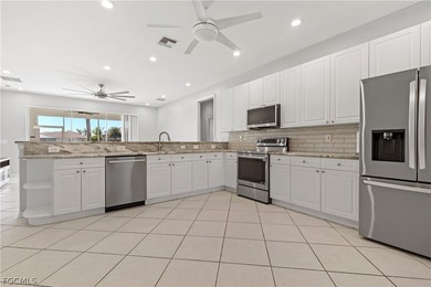 SILVERLAKES SHOWSTOPPER WITH BRAND NEW TILE ROOF & WATERFRONT on Gateway Golf and Country Club in Florida - for sale on GolfHomes.com, golf home, golf lot