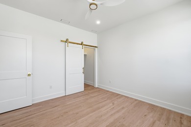 Brand-new 2025 coastal luxury home just steps from the Gulf! on Sharks Tooth Golf Club in Florida - for sale on GolfHomes.com, golf home, golf lot