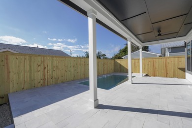 Brand-new 2025 coastal luxury home just steps from the Gulf! on Sharks Tooth Golf Club in Florida - for sale on GolfHomes.com, golf home, golf lot