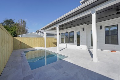 Brand-new 2025 coastal luxury home just steps from the Gulf! on Sharks Tooth Golf Club in Florida - for sale on GolfHomes.com, golf home, golf lot