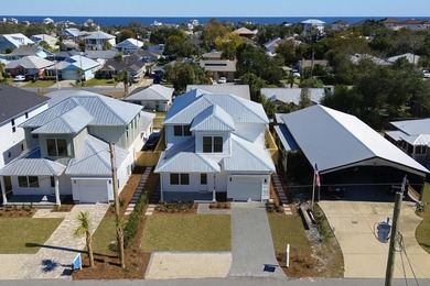 Brand-new 2025 coastal luxury home just steps from the Gulf! on Sharks Tooth Golf Club in Florida - for sale on GolfHomes.com, golf home, golf lot