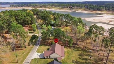 Experience lakeside living at its finest with this stunning 3 on Rayburn Country Club in Texas - for sale on GolfHomes.com, golf home, golf lot