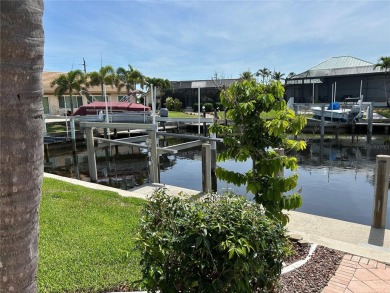 ESCAPE TO YOUR WATERFRONT DREAM HOME IN PUNTA GORDA ISLES! This on Saint Andrews South Golf Club in Florida - for sale on GolfHomes.com, golf home, golf lot