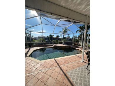 ESCAPE TO YOUR WATERFRONT DREAM HOME IN PUNTA GORDA ISLES! This on Saint Andrews South Golf Club in Florida - for sale on GolfHomes.com, golf home, golf lot