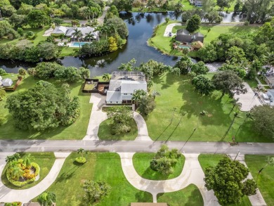 Your Private Oasis Awaits in Whippoorwill Lakes! Tucked away in on Banyan Golf Club in Florida - for sale on GolfHomes.com, golf home, golf lot
