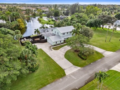 Your Private Oasis Awaits in Whippoorwill Lakes! Tucked away in on Banyan Golf Club in Florida - for sale on GolfHomes.com, golf home, golf lot