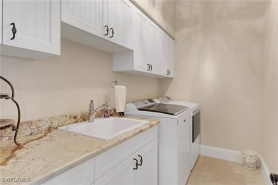Discover refined Florida living in this stunning TURNKEY on Royal Tee Country Club in Florida - for sale on GolfHomes.com, golf home, golf lot