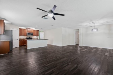 Welcome to this meticulously maintained 4-bedroom, 2-bath on Grand Reserve Golf Course in Florida - for sale on GolfHomes.com, golf home, golf lot