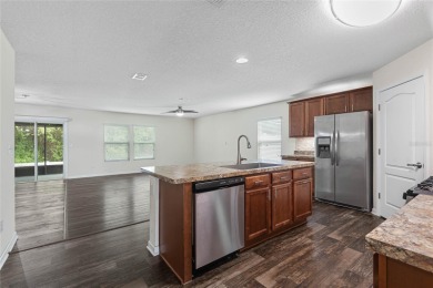 Welcome to this meticulously maintained 4-bedroom, 2-bath on Grand Reserve Golf Course in Florida - for sale on GolfHomes.com, golf home, golf lot