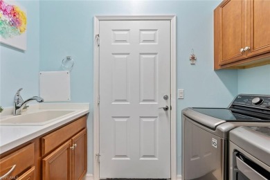 PREMIUM GOLF & WATER VIEW ~ FORMER MODEL HOME ~ TURNKEY with on Panther Run Golf Club in Florida - for sale on GolfHomes.com, golf home, golf lot