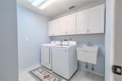 Beautifully maintained 3-bedroom, 2-bath pool home in the on East Lake Woodlands Country Club in Florida - for sale on GolfHomes.com, golf home, golf lot