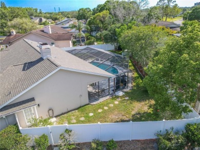 Beautifully maintained 3-bedroom, 2-bath pool home in the on East Lake Woodlands Country Club in Florida - for sale on GolfHomes.com, golf home, golf lot
