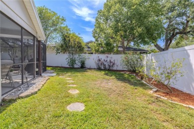 Beautifully maintained 3-bedroom, 2-bath pool home in the on East Lake Woodlands Country Club in Florida - for sale on GolfHomes.com, golf home, golf lot