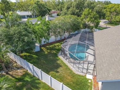 Beautifully maintained 3-bedroom, 2-bath pool home in the on East Lake Woodlands Country Club in Florida - for sale on GolfHomes.com, golf home, golf lot