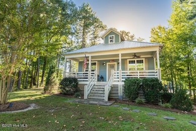 Nestled at the end of the cul de sac, this creek cottage will on Minnesott Golf and Country Club in North Carolina - for sale on GolfHomes.com, golf home, golf lot