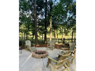 Nestled at the end of the cul de sac, this creek cottage will on Minnesott Golf and Country Club in North Carolina - for sale on GolfHomes.com, golf home, golf lot