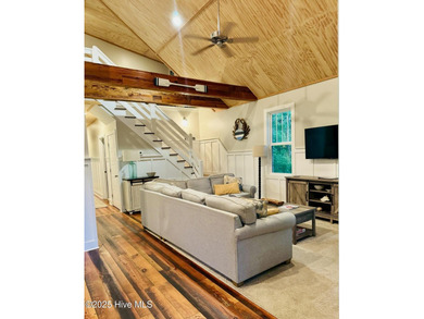 Nestled at the end of the cul de sac, this creek cottage will on Minnesott Golf and Country Club in North Carolina - for sale on GolfHomes.com, golf home, golf lot