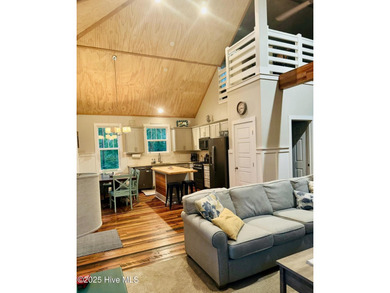 Nestled at the end of the cul de sac, this creek cottage will on Minnesott Golf and Country Club in North Carolina - for sale on GolfHomes.com, golf home, golf lot