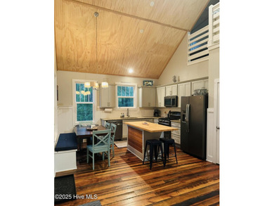 Nestled at the end of the cul de sac, this creek cottage will on Minnesott Golf and Country Club in North Carolina - for sale on GolfHomes.com, golf home, golf lot