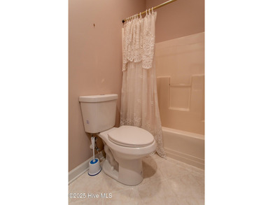 This is a gorgeous brick, 3-bedroom, 4 full-bathroom home in The on Sound Golf Links at Albemarle Plantation in North Carolina - for sale on GolfHomes.com, golf home, golf lot