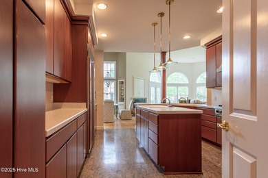 This is a gorgeous brick, 3-bedroom, 4 full-bathroom home in The on Sound Golf Links at Albemarle Plantation in North Carolina - for sale on GolfHomes.com, golf home, golf lot