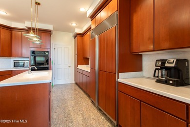 This is a gorgeous brick, 3-bedroom, 4 full-bathroom home in The on Sound Golf Links at Albemarle Plantation in North Carolina - for sale on GolfHomes.com, golf home, golf lot