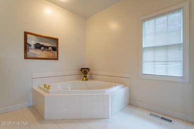 This is a gorgeous brick, 3-bedroom, 4 full-bathroom home in The on Sound Golf Links at Albemarle Plantation in North Carolina - for sale on GolfHomes.com, golf home, golf lot