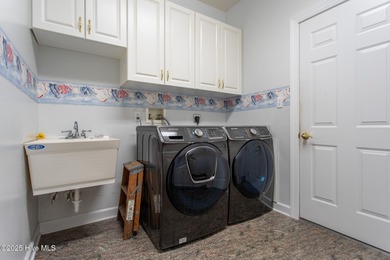 This is a gorgeous brick, 3-bedroom, 4 full-bathroom home in The on Sound Golf Links at Albemarle Plantation in North Carolina - for sale on GolfHomes.com, golf home, golf lot