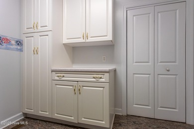 This is a gorgeous brick, 3-bedroom, 4 full-bathroom home in The on Sound Golf Links at Albemarle Plantation in North Carolina - for sale on GolfHomes.com, golf home, golf lot