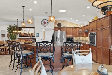 This expanded designer LAUREL OAK home features 3 bedrooms and 2 on Bella Glade Country Club in Florida - for sale on GolfHomes.com, golf home, golf lot