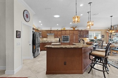 This expanded designer LAUREL OAK home features 3 bedrooms and 2 on Bella Glade Country Club in Florida - for sale on GolfHomes.com, golf home, golf lot