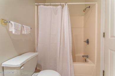 This is a gorgeous brick, 3-bedroom, 4 full-bathroom home in The on Sound Golf Links at Albemarle Plantation in North Carolina - for sale on GolfHomes.com, golf home, golf lot